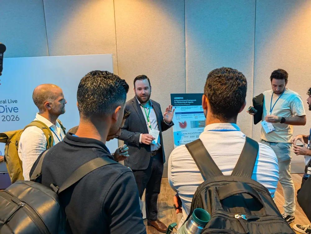 SEOs and Googlers gathered around John McAlpin's poster